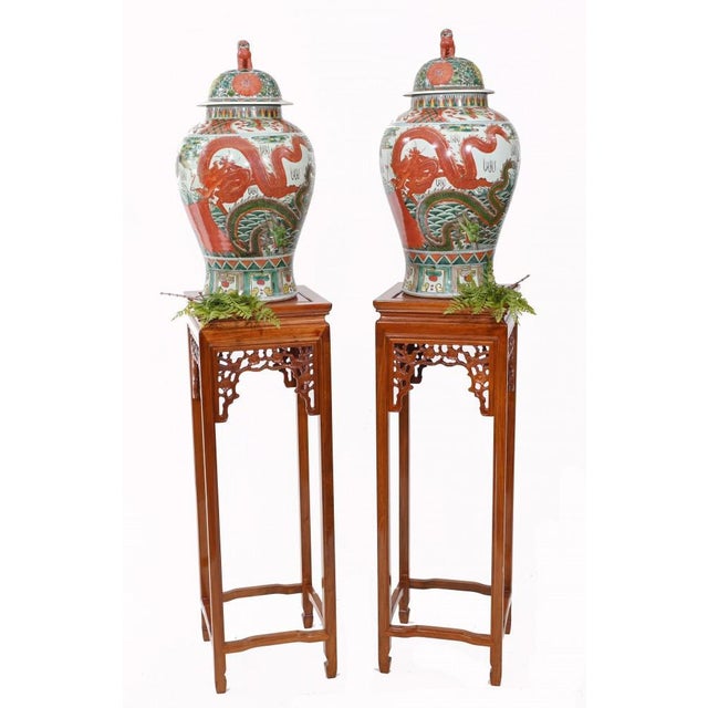 Gorgeous pair of Chinese pedestal stand tables. Classic tall pair, perfect for displaying urns or vases. Vases pictured...