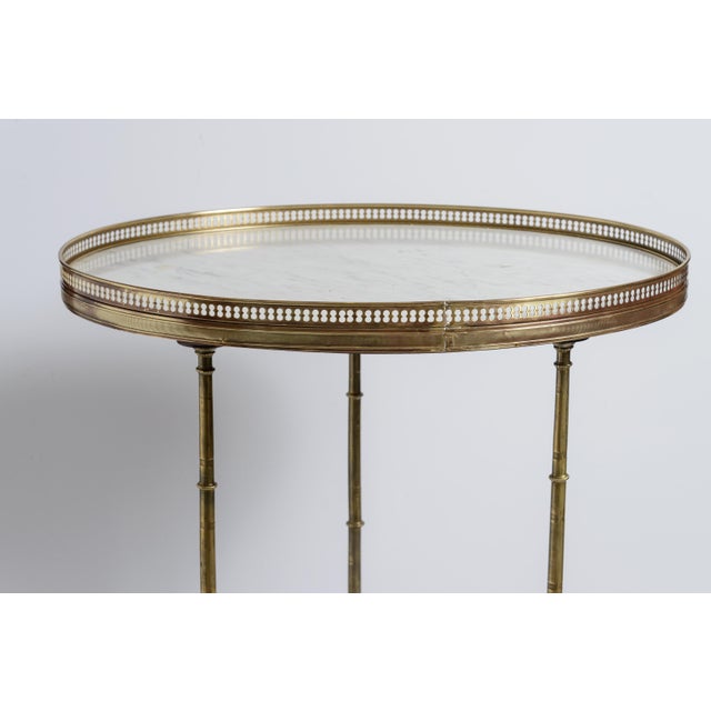 Just in this wonderful French White Marble Top and Brass Gallery Top End Table, Brass Legs. This elegant French...