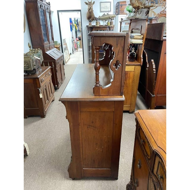 Available is a hand carved wooden hutch that is over 100 years old. This piece is detailed top to bottom with authentic...