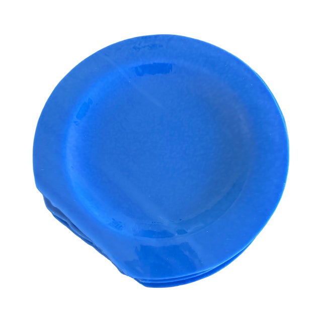 Set of twelve signed studio art glass plates in a beautiful cornflower blue with an opaque, clouded finish and soft satin-...