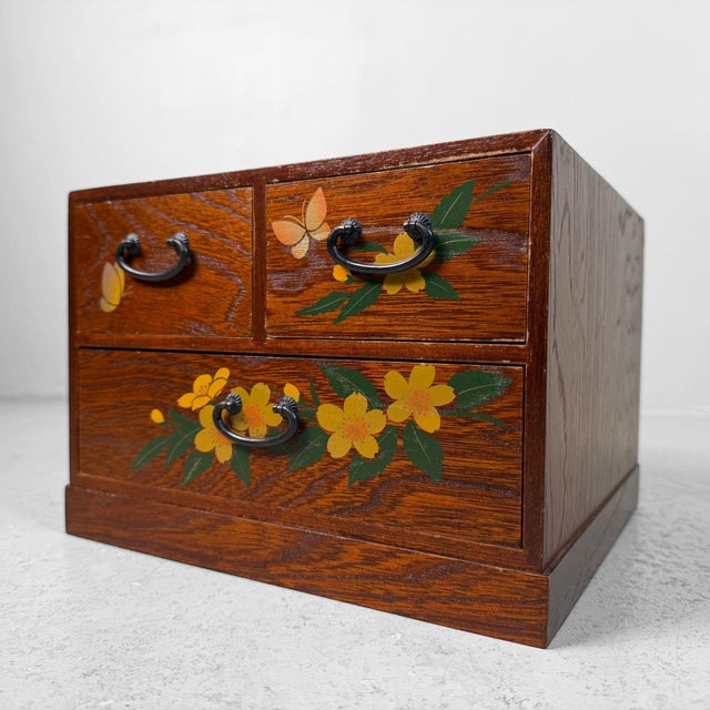 Charming small Japanese drawer chest from the 1980s, made of warmly toned wood with a beautifully visible grain....