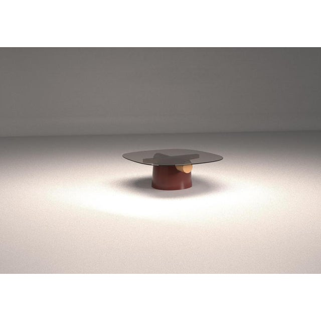 Betty coffee table by haymann editions dimensions: d 125 x w 125 x h 41.5 cm. Materials: lacquered wood, smoked glass. The...