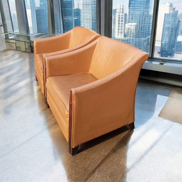 Upholstered in a rich, cognac-toned leather, these chairs exude an air of opulence and refinement, making them a true...