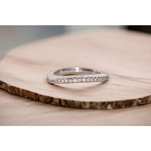 The Contour: Designer Signed Contour Band with Natural Diamonds in Platinum. Indulge in the luxury of this exquisite band,...