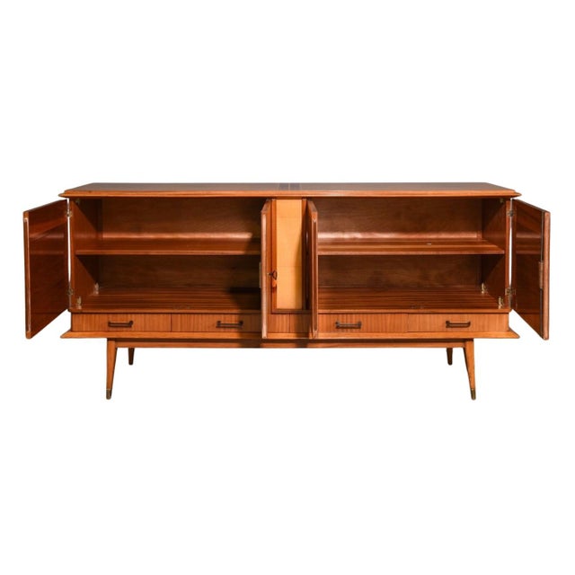 Sleek, sculptural, and endlessly chic, this mid-century modern French sideboard is a showstopper. Crafted in the...