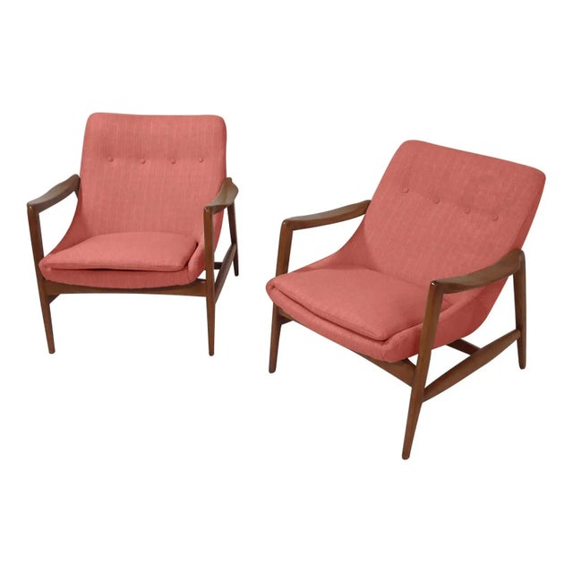 Stunning lounge chairs; Mid-century style at its finest! Frames are walnut with a walnut finish /satin and upholstered in...