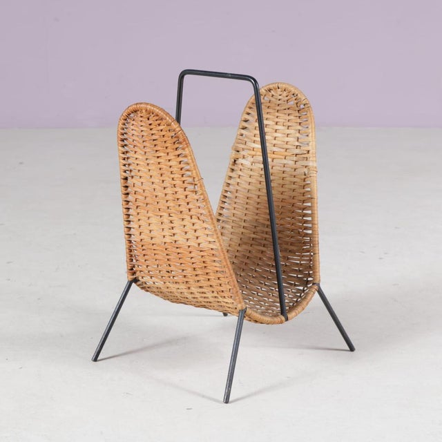 A lovely magazine rack made of high quality rattan attributed to Carl Auböck, manufactured by Illums Bolighus in Denmark...