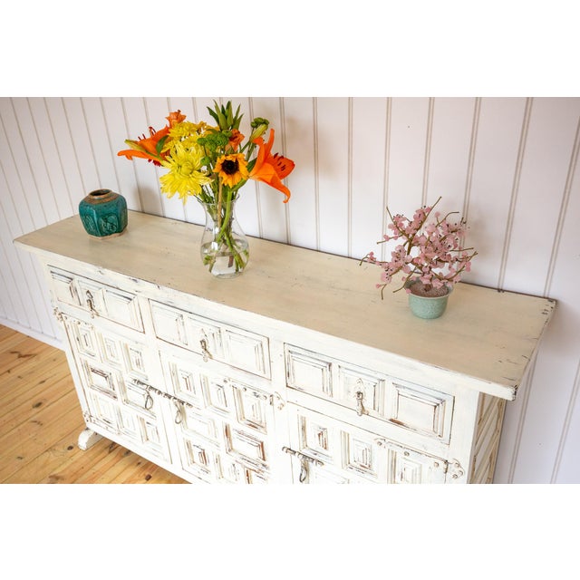 An attractive and impressive Spanish solid wood and wrought iron sideboard-credenza in lovely antique condition. Most...