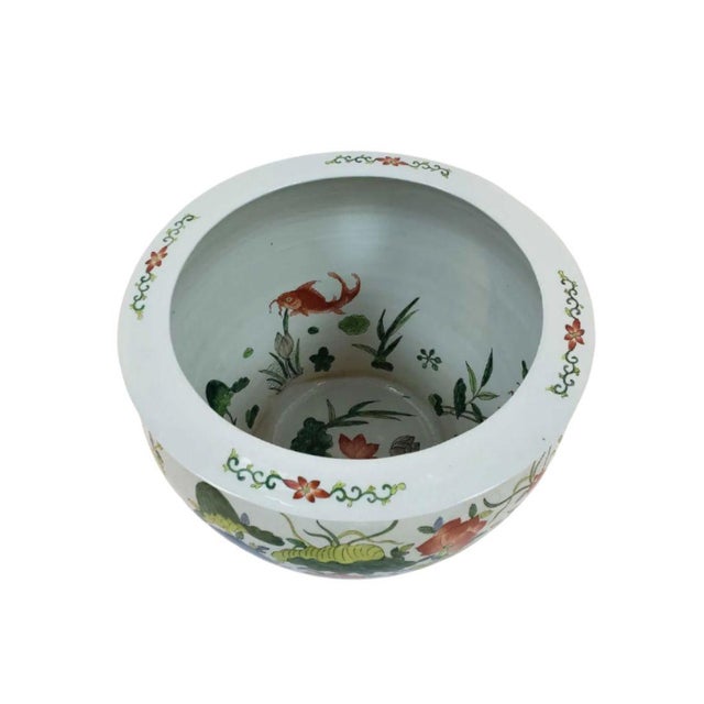 This elegant Chinoiserie planter features vibrant hand-painted florals and traditional Asian-inspired motifs that bring...