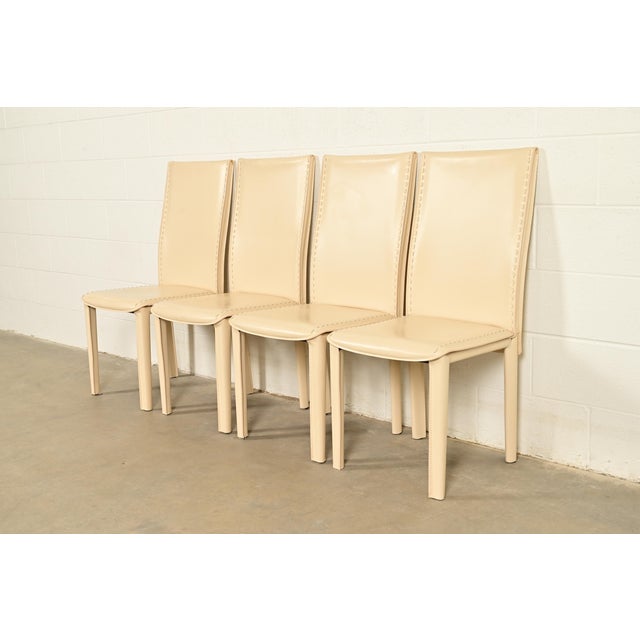 A sleek and stylish set of four Italian Modern or Postmodern high back dining chairs In the manner of Mario Bellini for...