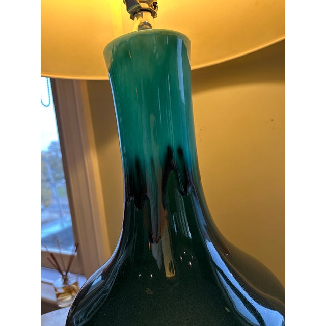 Sculptural pair of oversized vintage ceramic table lamps featuring rich high-gloss drip glazes in layered teal and deep...