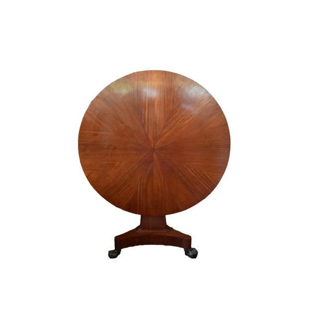 Walnut Folding dining table with a pedestal base. Iron claw feet.