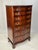 A rare flame mahogany serpentine tall chest of drawers by Henkel Harris. Crafted in Winchester, Virginia in 2003, this...