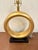 Modern Currey & Co Lamp. Gold ring body on black marble base. Showroom floor sample.