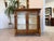 Empire-style wall shelf/display cabinet. Dimensions: Height x Width x Depth 101 x 103 x 61 cm. For sale is an original...