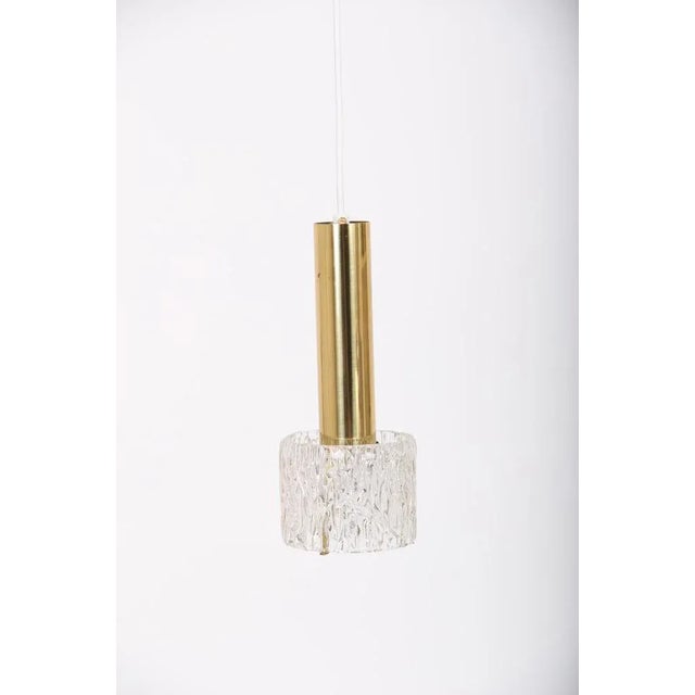 Pendlel. Brass pendulum with Orrefors glass. Nice used condition with light normal signs of wear. I have official proof of...