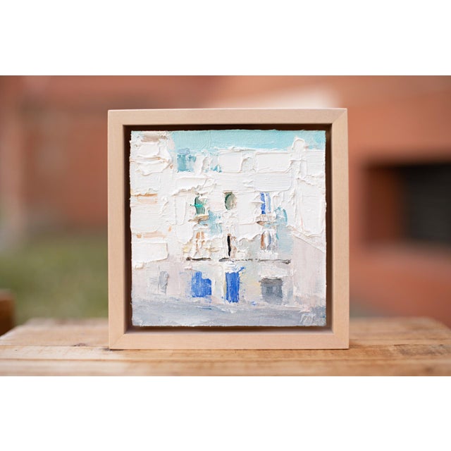 This artwork presents a textured depiction of a Lisbon street scene, characterized by soft pastel hues and expressive...