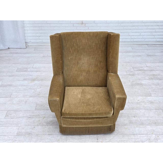 1970s, Danish highback armchair. Original honey yellow furniture velour, beech wood legs. Original good condition: no...