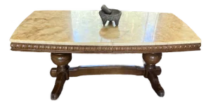 Wilhelminian-Style Coffee Table Features a Polished Honey-Toned Onyx or Marble Slab Top Resting on an Ornately Carved Double-Pedestal Wooden Base