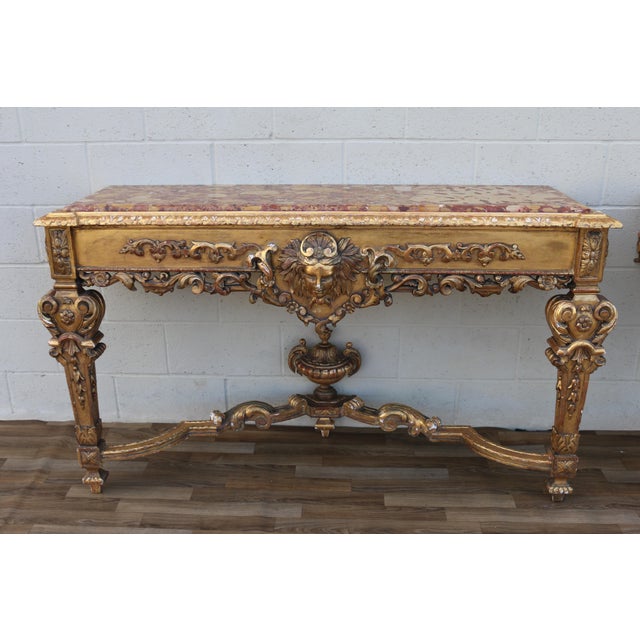 An exceptional pair of Antique Italian Baroque / Neoclassical console tables, dating to the early 1900s. Richly hand-...