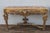 An exceptional pair of Antique Italian Baroque / Neoclassical console tables, dating to the early 1900s. Richly hand-...