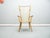 Filigree and rare cherry wood wing chair by Albert Haberer. The design comes from the 1949s. This armchair comes from the...
