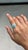 This Contemporary Double Halo Ring features a captivating 1.43 carat natural oval turquoise, set in 14k yellow gold. The...