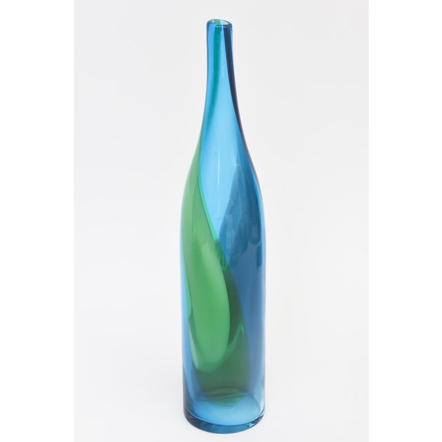 This fabulous vintage Danish tall glass bottle is swirls of gorgeous hues of colors of turquoise, blue, green and purple...