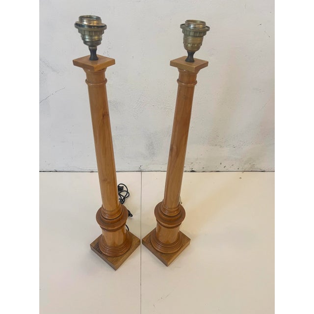 Pair of Wooden Table Lamps one does have a Label of Fornasetti maker. The wiring is 2 different colors one black wire the...