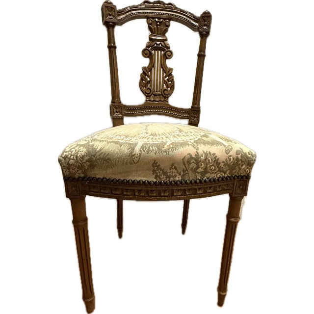 A truly unique pair of vintage hand-carved accent chairs, each showcasing beautiful craftsmanship and timeless detail....