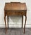 Charming antique oak slant-front secretary desk featuring a graceful silhouette, beautiful oak grain, and elegant Queen...