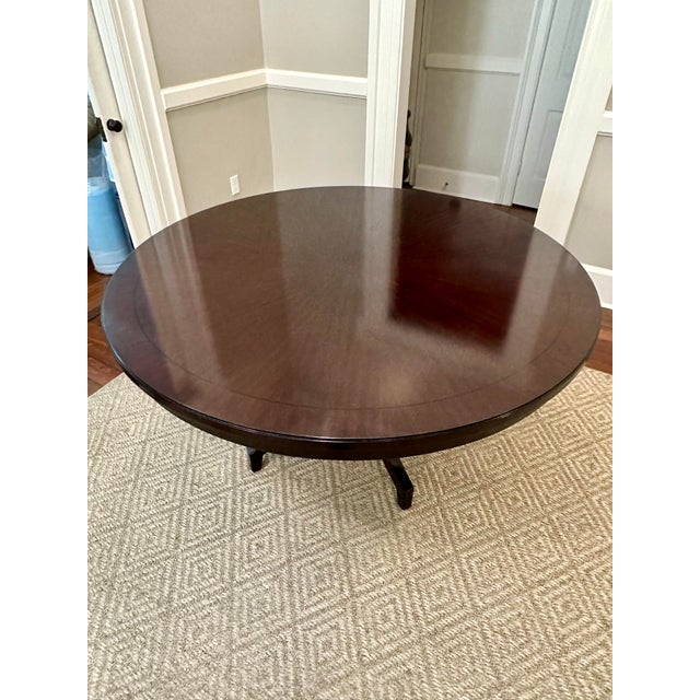Beautiful mahogany inlay with ebony edge border makes for enjoyable dining. This stunning 16-piece radial matched Ribbon...