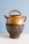 This 19th-century French pottery jug from Provence is decorated in a gorgeous ochre glaze and bare clay on the lower part....