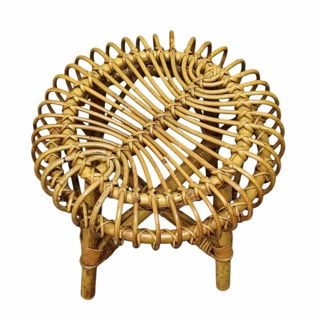 A round stool in curved rattan and bamboo from the mid-20th century, designed by Francesco Albini. Albini was among the...