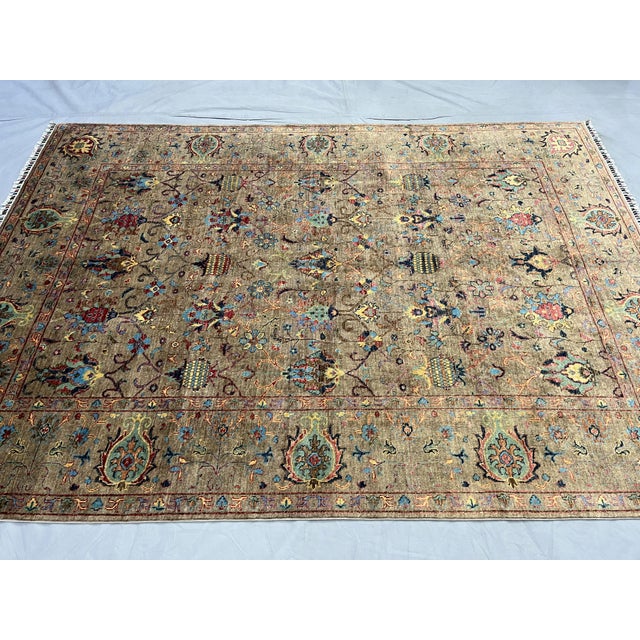 Bring earthy color and intricate botanical detail to your home with this Afghan Sultani natural dye wool area rug. A warm...