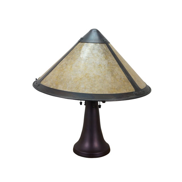 Circa 2000 large trumpet shaped three light Arts and Crafts / mission style table lamp. Made of copper with a dark patina....