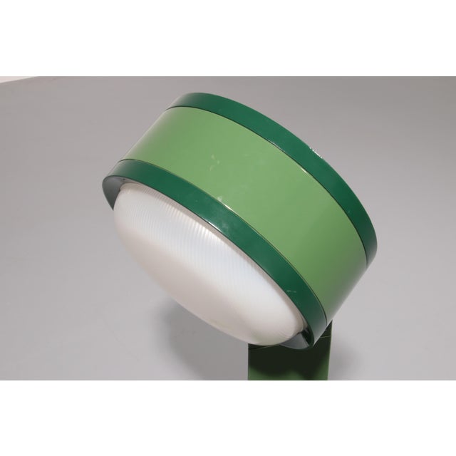 The Tamburo lamp, designed by Afra & Tobia Scarpa for Flos in 1973, is a timeless expression of Italian design innovation....