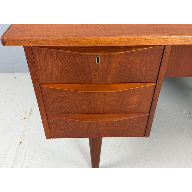 Scandinavian modern period desk made in 1960's Denmark The desk made of teak wood and is in a good vintage condition with...