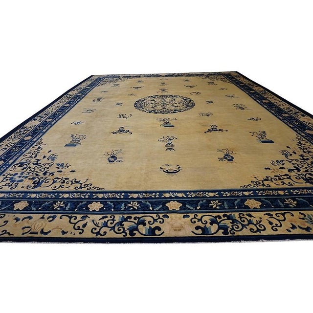 Chinese Wool - Peking Rectangle Room Size Ivory Antique 1920s Knotted Rug, Circa Date: 1920s. This exceptional example of...
