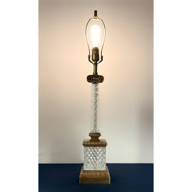 A sophisticated "Statement Piece" in the style of the Marbro Lamp Company. This 1960s Neoclassical column lamp features a...