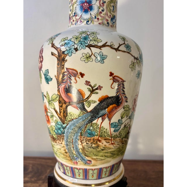 A striking pair of vintage Italian porcelain table lamps featuring beautifully hand-painted chinoiserie decoration. Each...