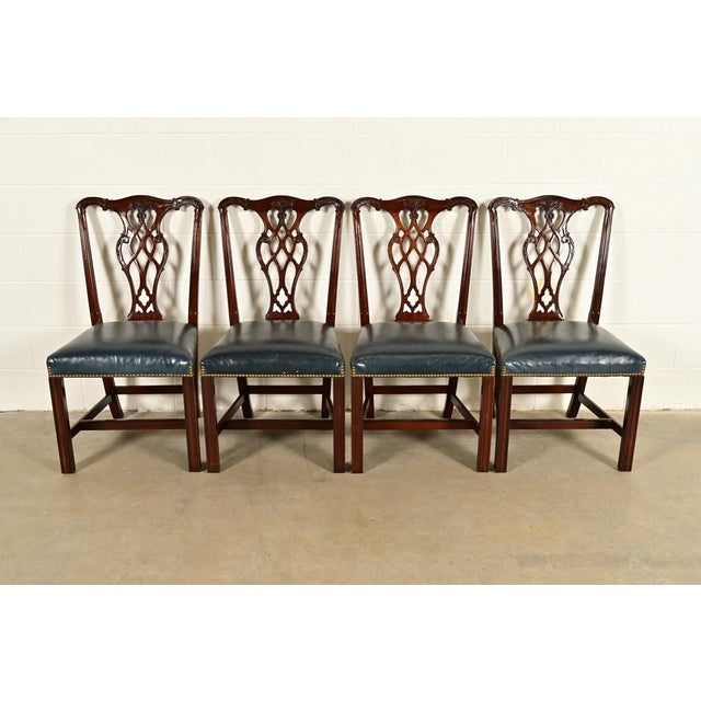 A gorgeous set of four Georgian or Chippendale style dining chairs By Councill Craftsmen USA, Circa 1980s Carved solid...