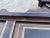 A distinctive antique American folk art hall mirror, dating to approximately the late 19th or early 20th century,...