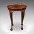 This is an antique oval side table. An English, burr walnut and beech lamp or wine table with pie crust top, dating to the...