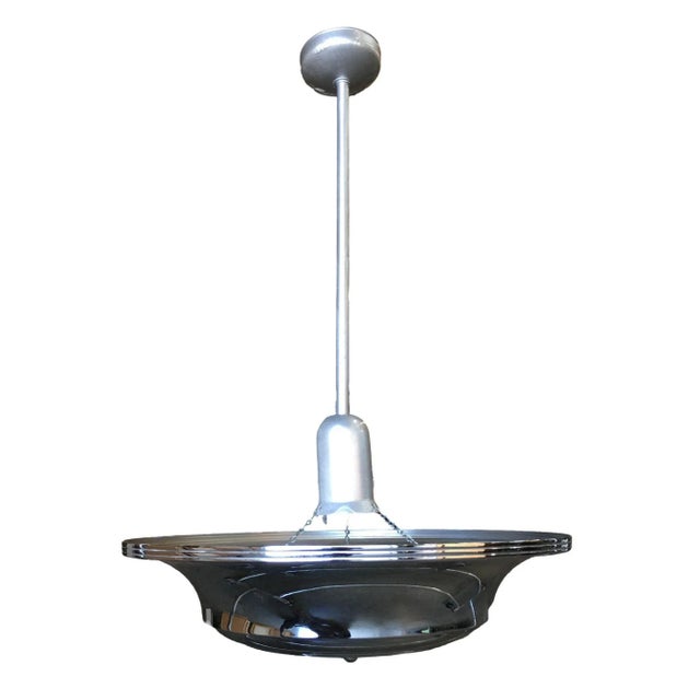 Two two-layer chromed steel Art Deco Streamline saucer ceiling pendant lamp featuring a round layered design. The light is...