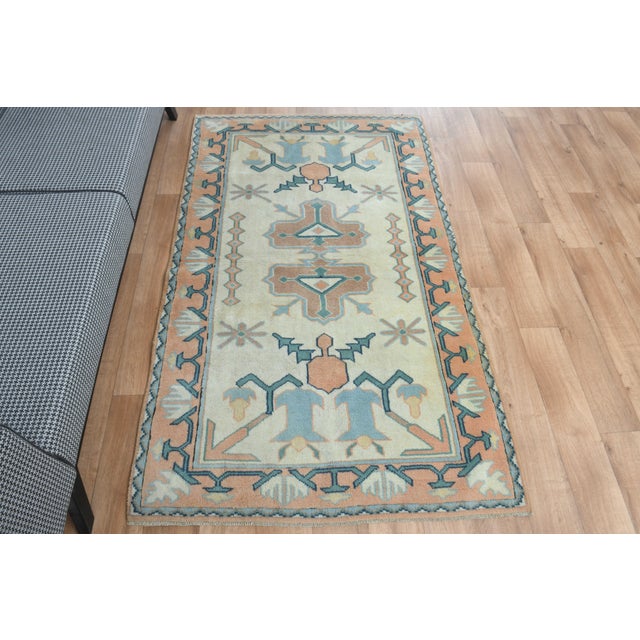 Vintage Hand-Knotted runner rug is a semi-antique vintage area rug. The '70s Eastern region of Anatolia's unique rug is...
