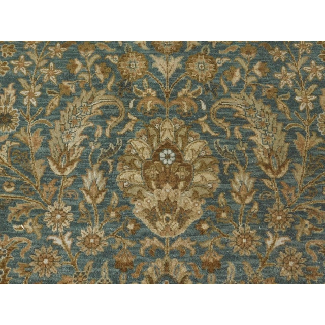 This antique re-creation master weaver rug features all over floral pattern.