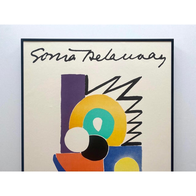 This Sonia Delaunay rare vintage 1978 Modernist lithograph print custom framed " Artcurial " Paris exhibition poster is an...