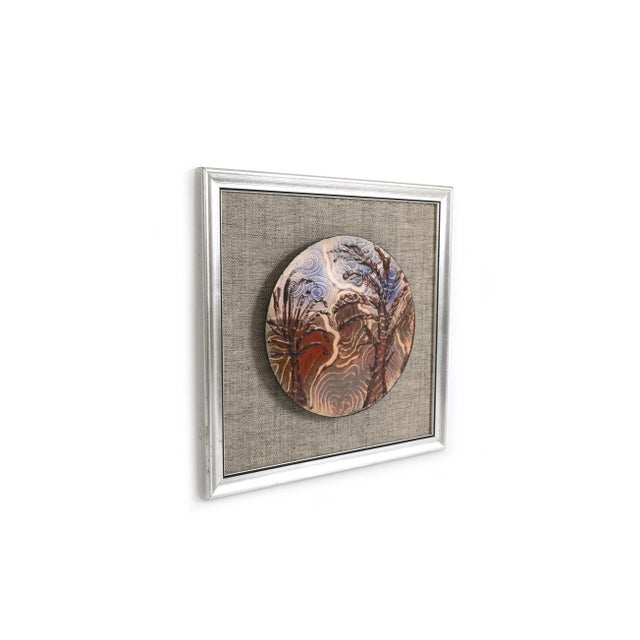 Fantastic little mid century modern art enameled copper disk, mounted on tweed fabric and framed in a silver gilded wooden...