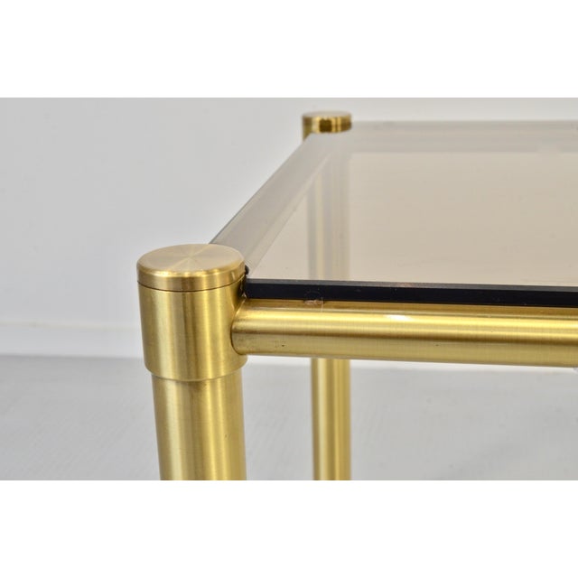 Tubular Brass and Smoked Glass Coffee Table, 1960s, in Very Good conditions. Designed 1970 to 1979